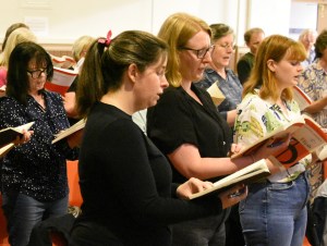 Photo of members of the choir at rehearsal